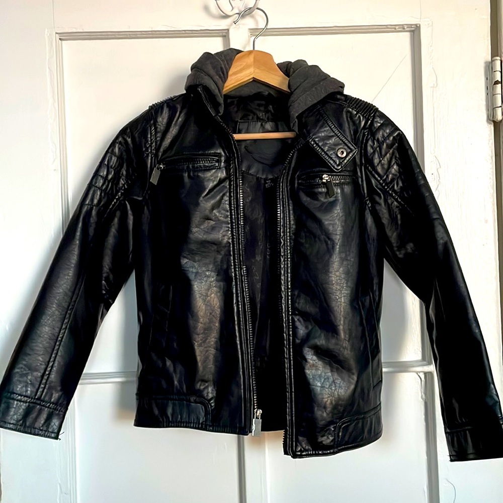 Black faux leather Urban Republic jacket marketed for boys. Grey fabric hoodie.